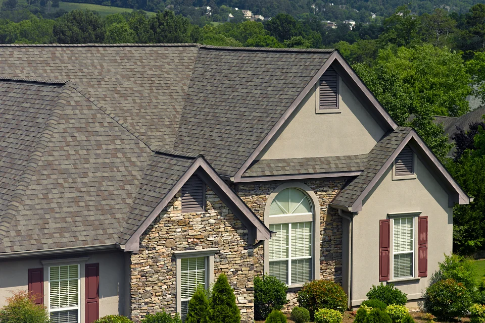 Landmark Weathered Wood Shingles on a house with red shutters